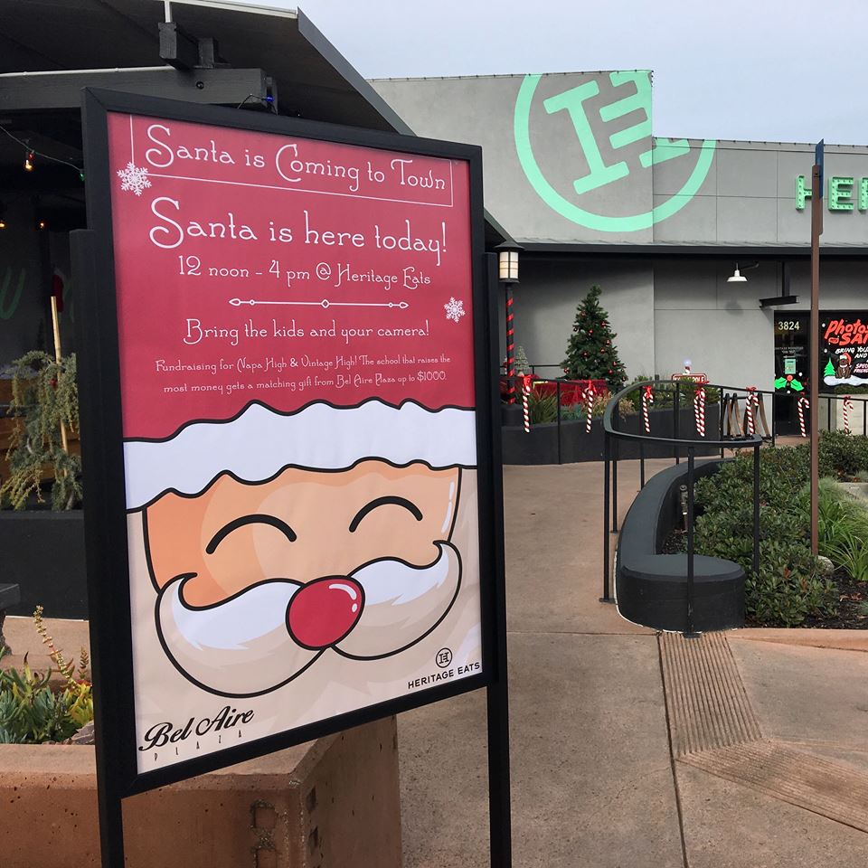 A sign that says santa is coming to town