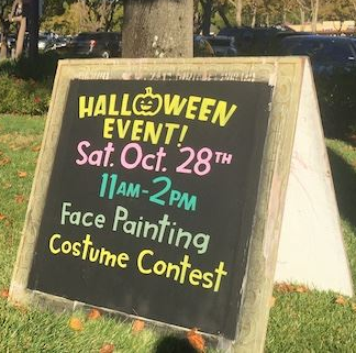 A sign that says halloween event on it
