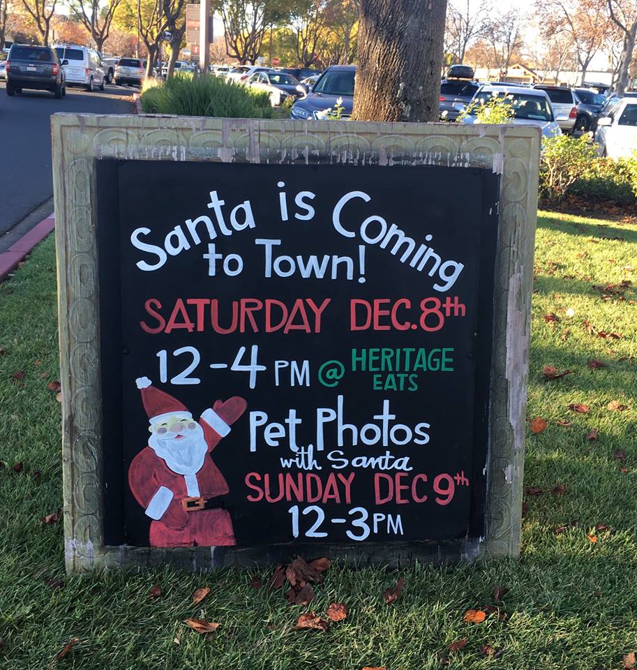 A sign that says santa is coming to town