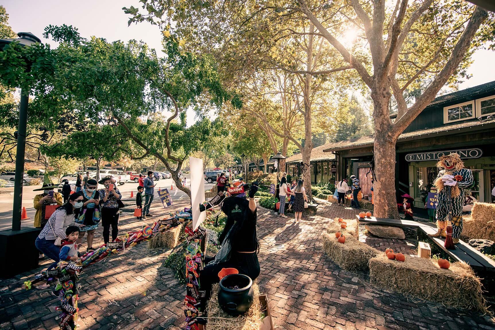 A group of people are gathered in a park.