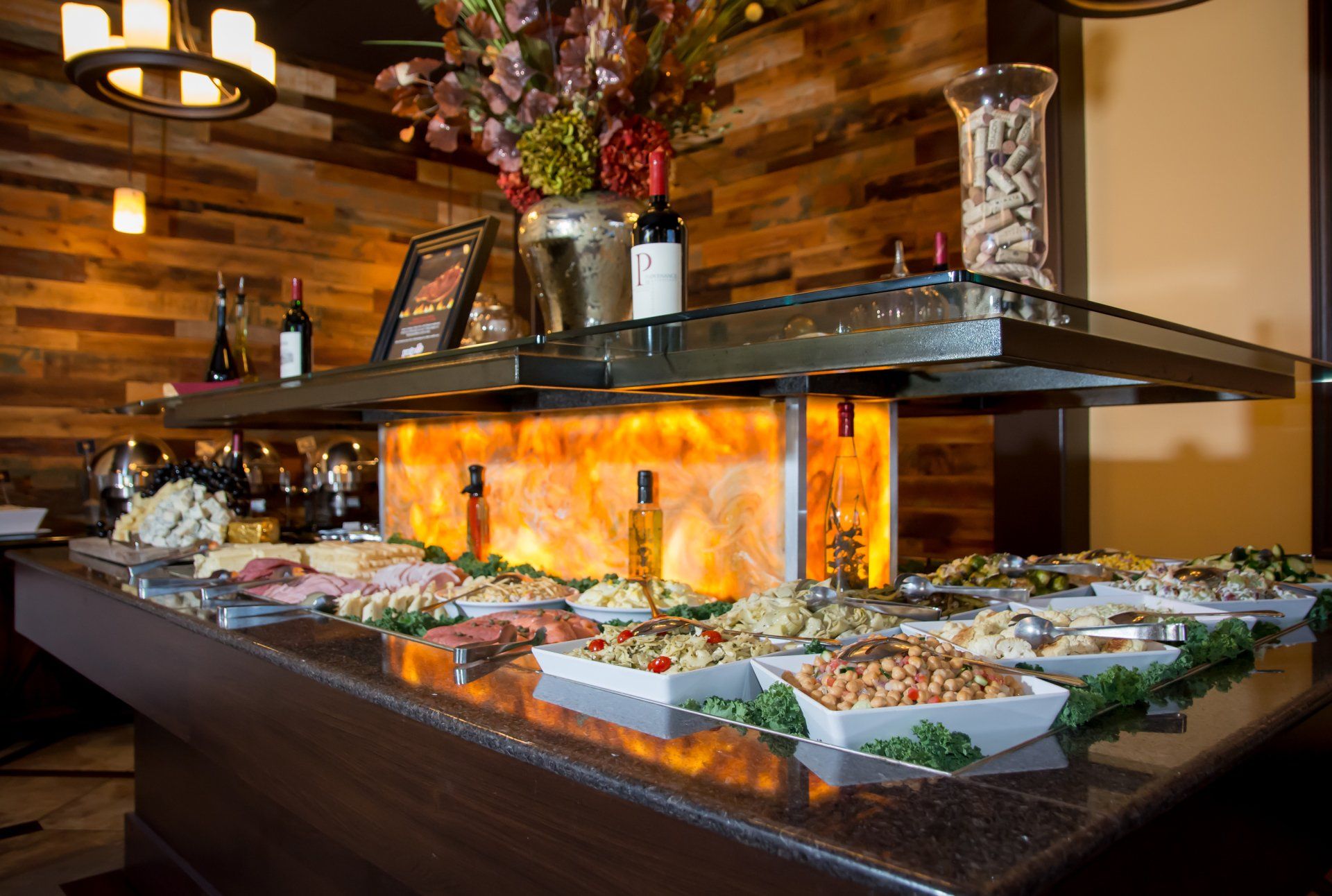 A buffet with a lot of food on it in a restaurant.