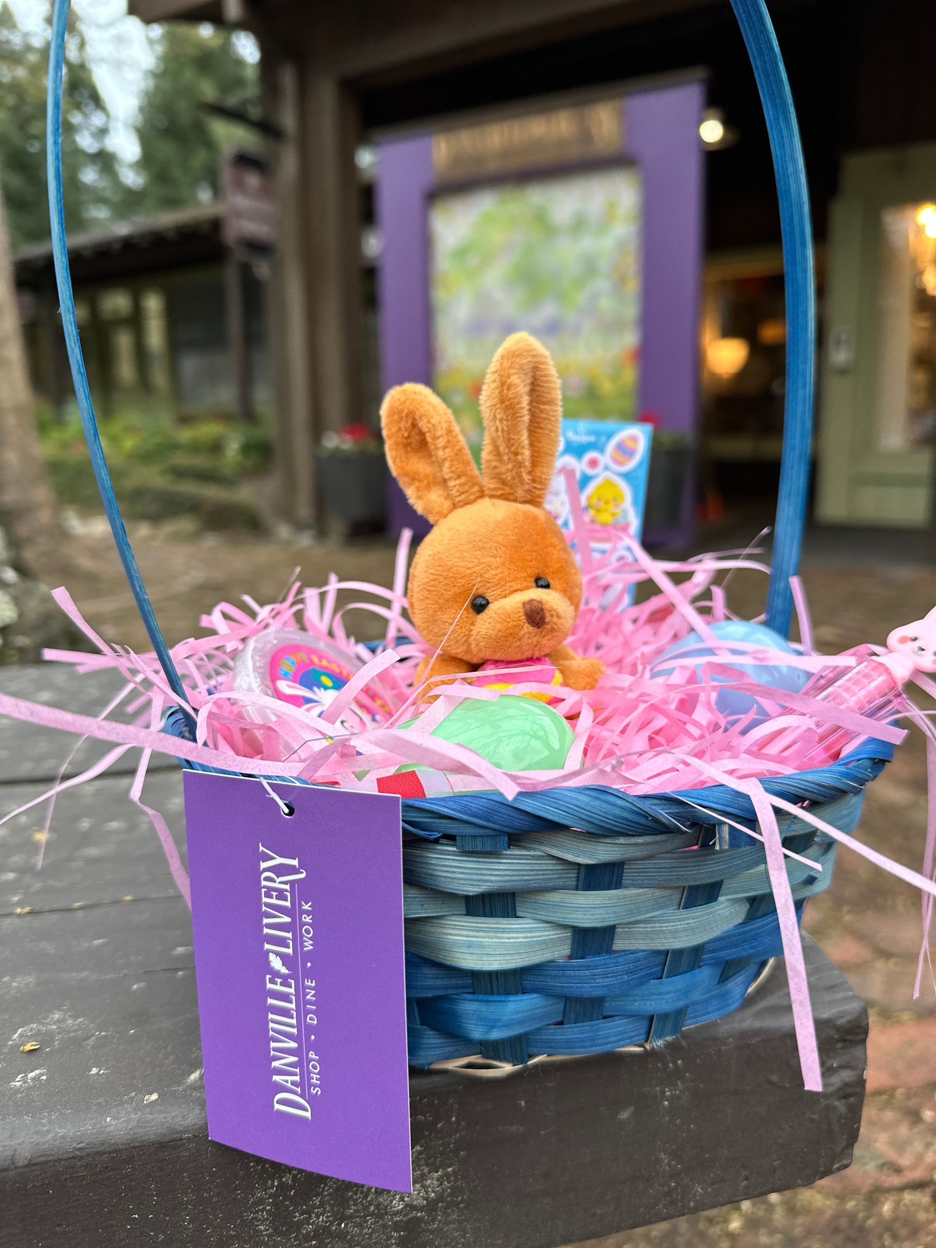 A group of people are standing in front of an inflatable water slide.