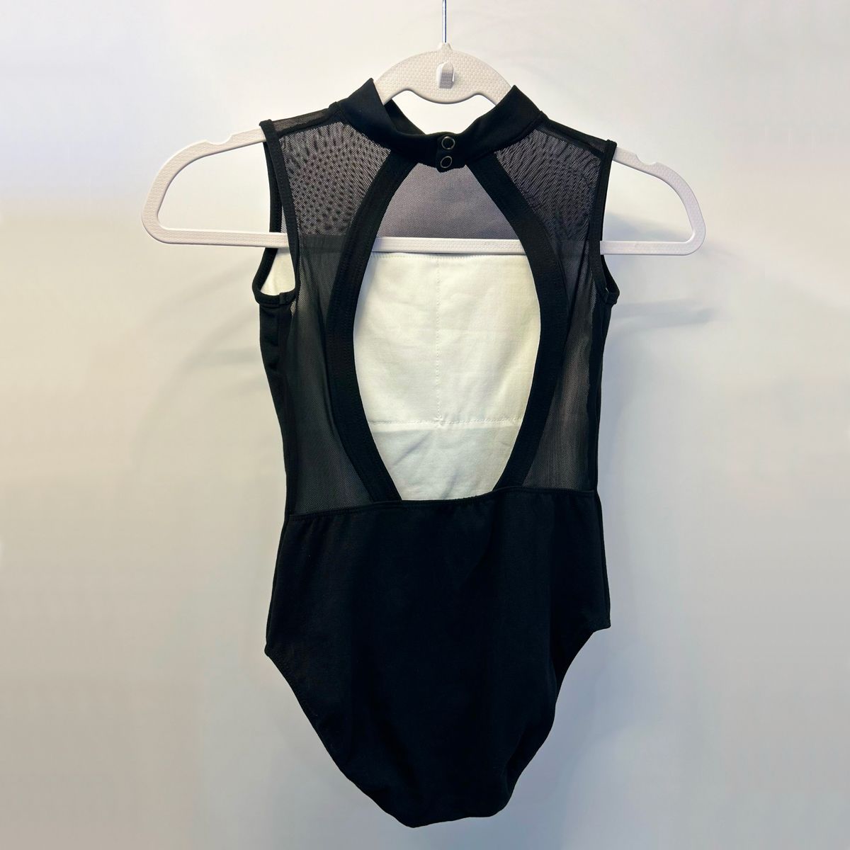 MAILLOT À COL HAUT SANS MANCHES