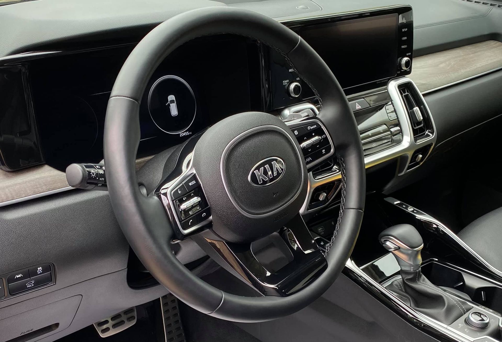A close up of a steering wheel in a car