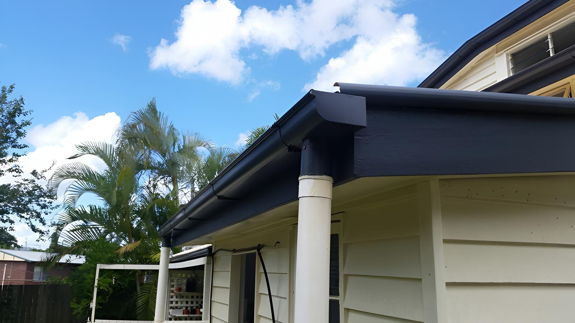 A White House With A Black Gutter On The Side — House Guttering in Bauple, QLD