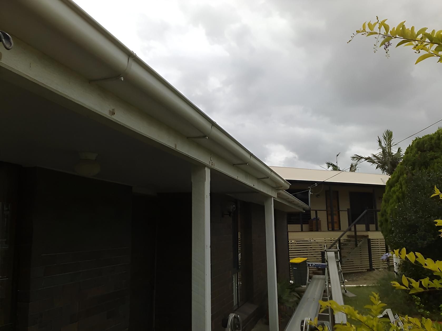 A House With A White Gutter On The Side Of It — House Guttering in Bauple, QLD