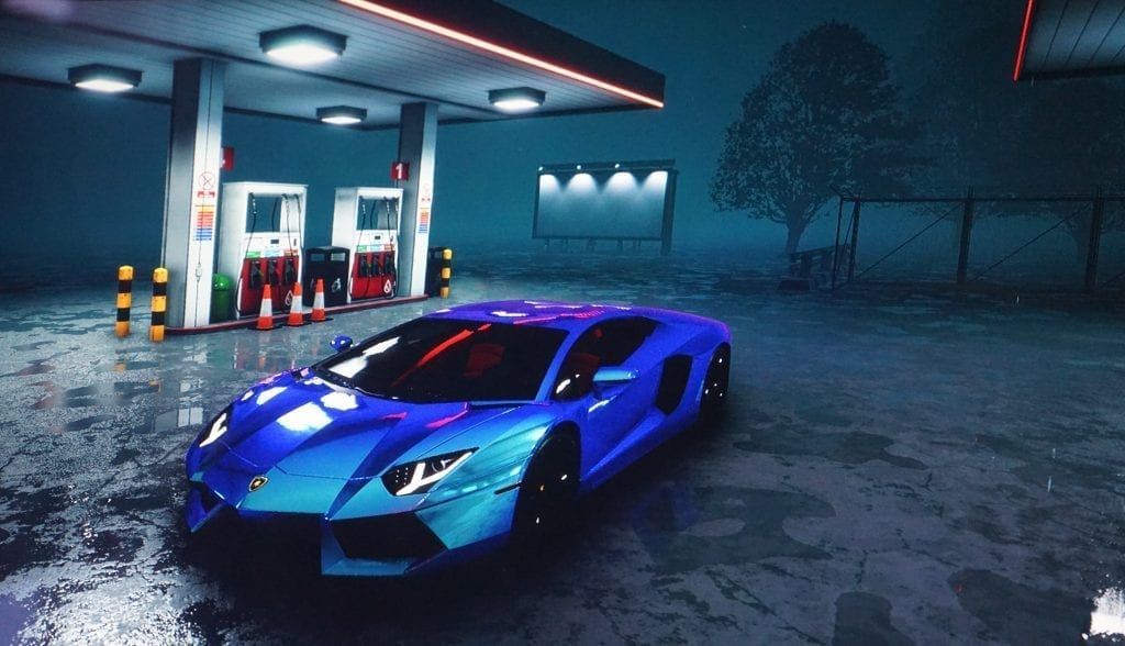 Blue Lamborghini parked at a gas station at night, under dim lights, in a misty setting.