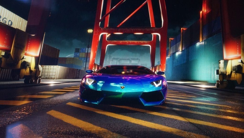 A blue Lamborghini drives through a shipping port at night, under red cranes.