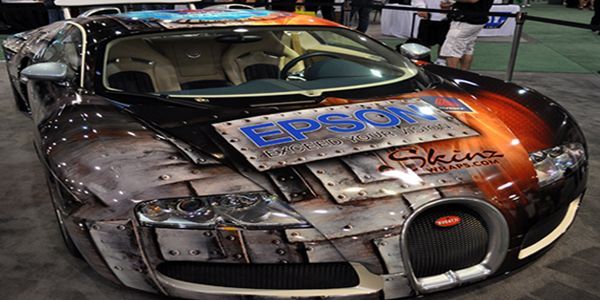Bugatti car with a custom paint job featuring metal panels and an Epson logo.