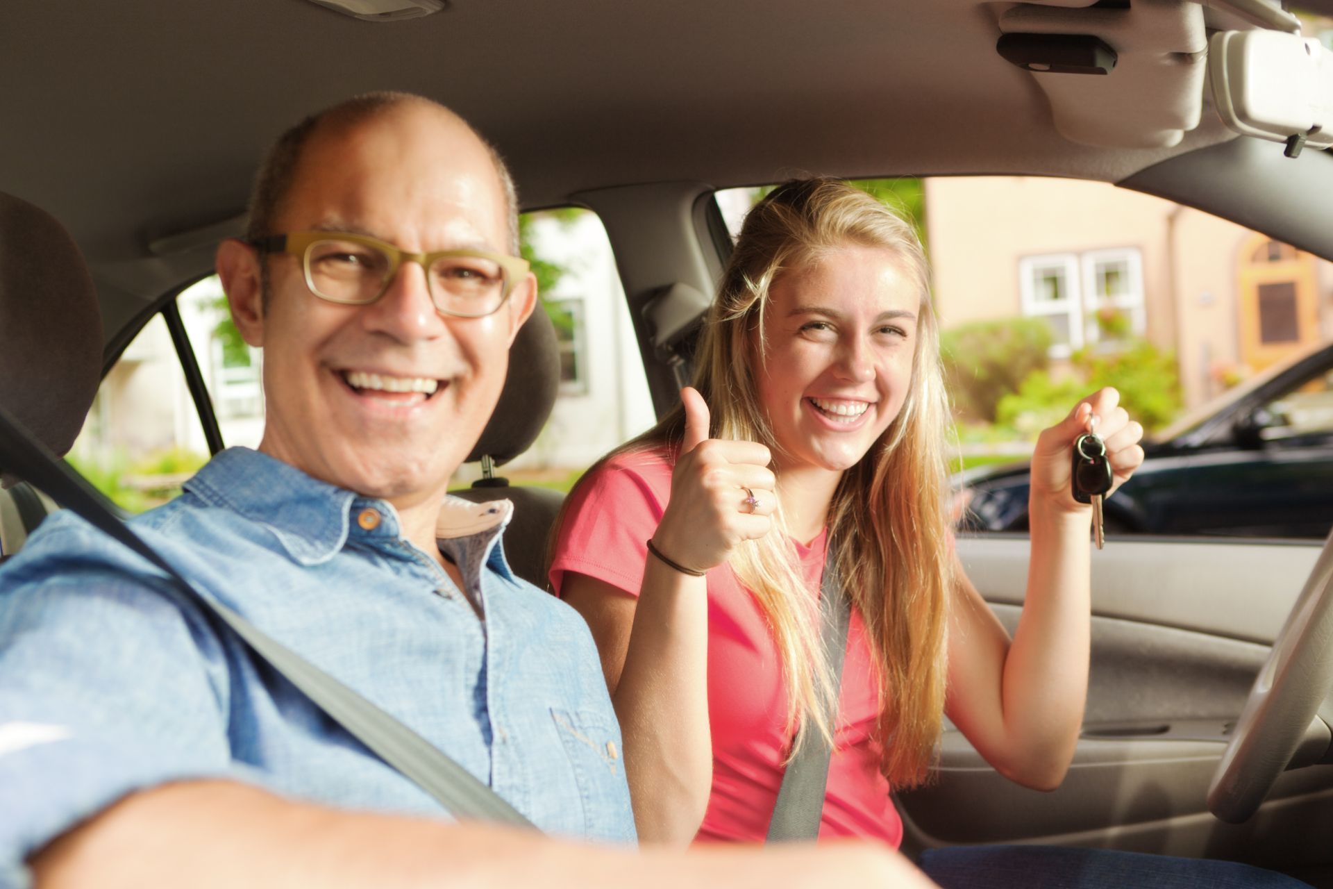 A man and a woman are standing next to each other and smiling.