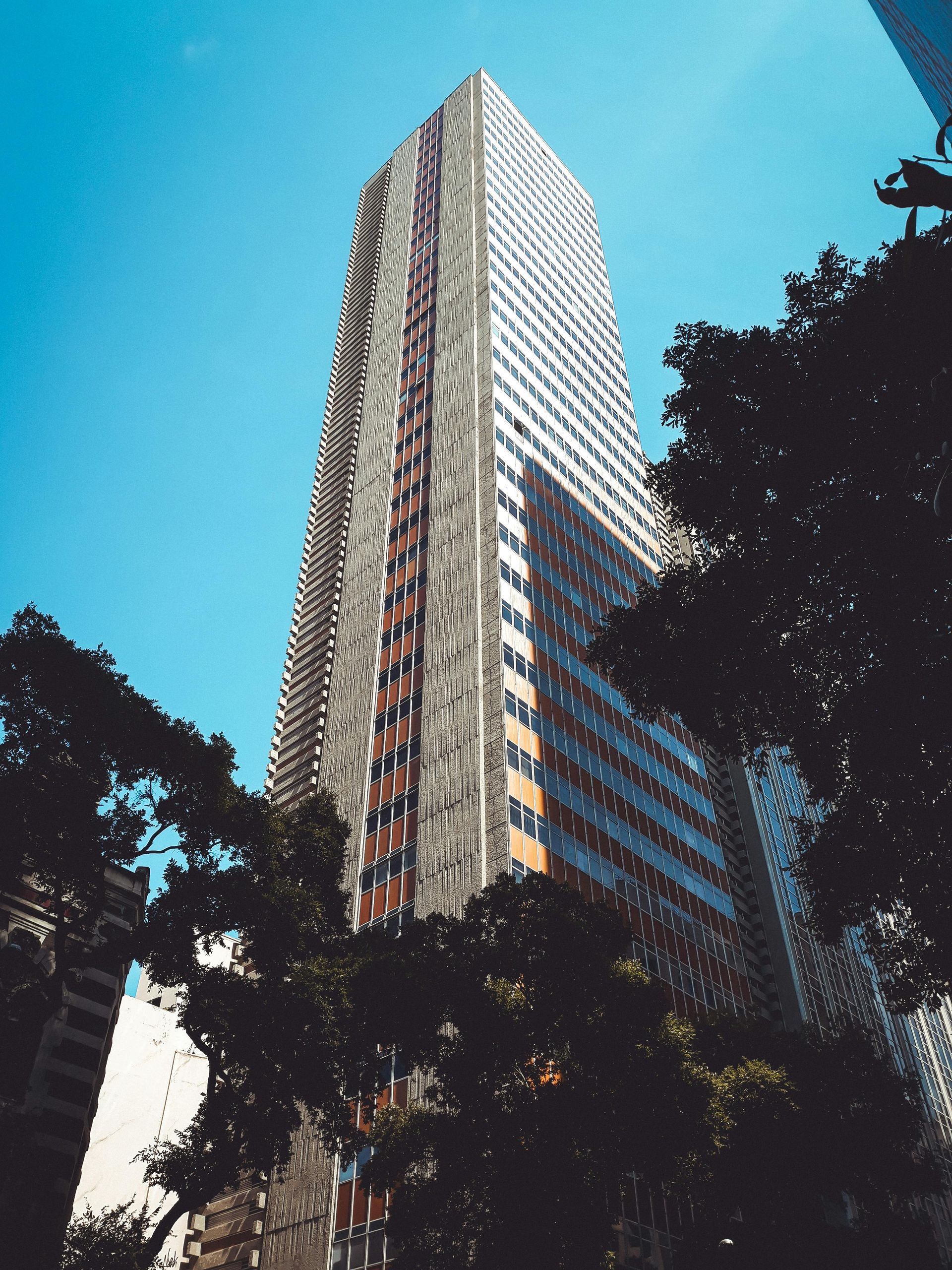 A man and a woman are standing next to each other and smiling.