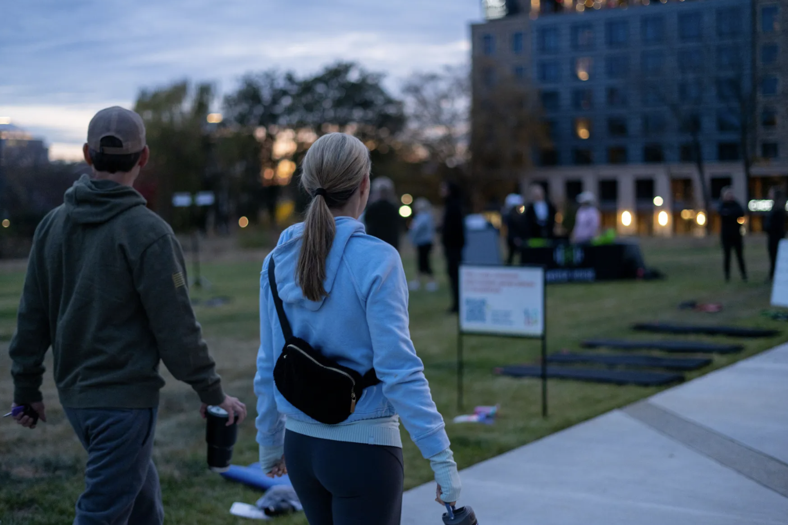 Couple practicing fitness at annul Charlotte event around an urban trail.