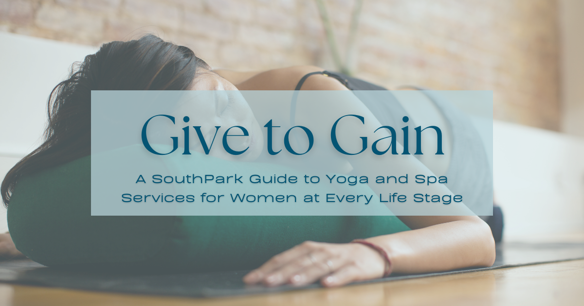 Woman resting in a restorative yoga pose on a mat at Palestra Spa & Studio.