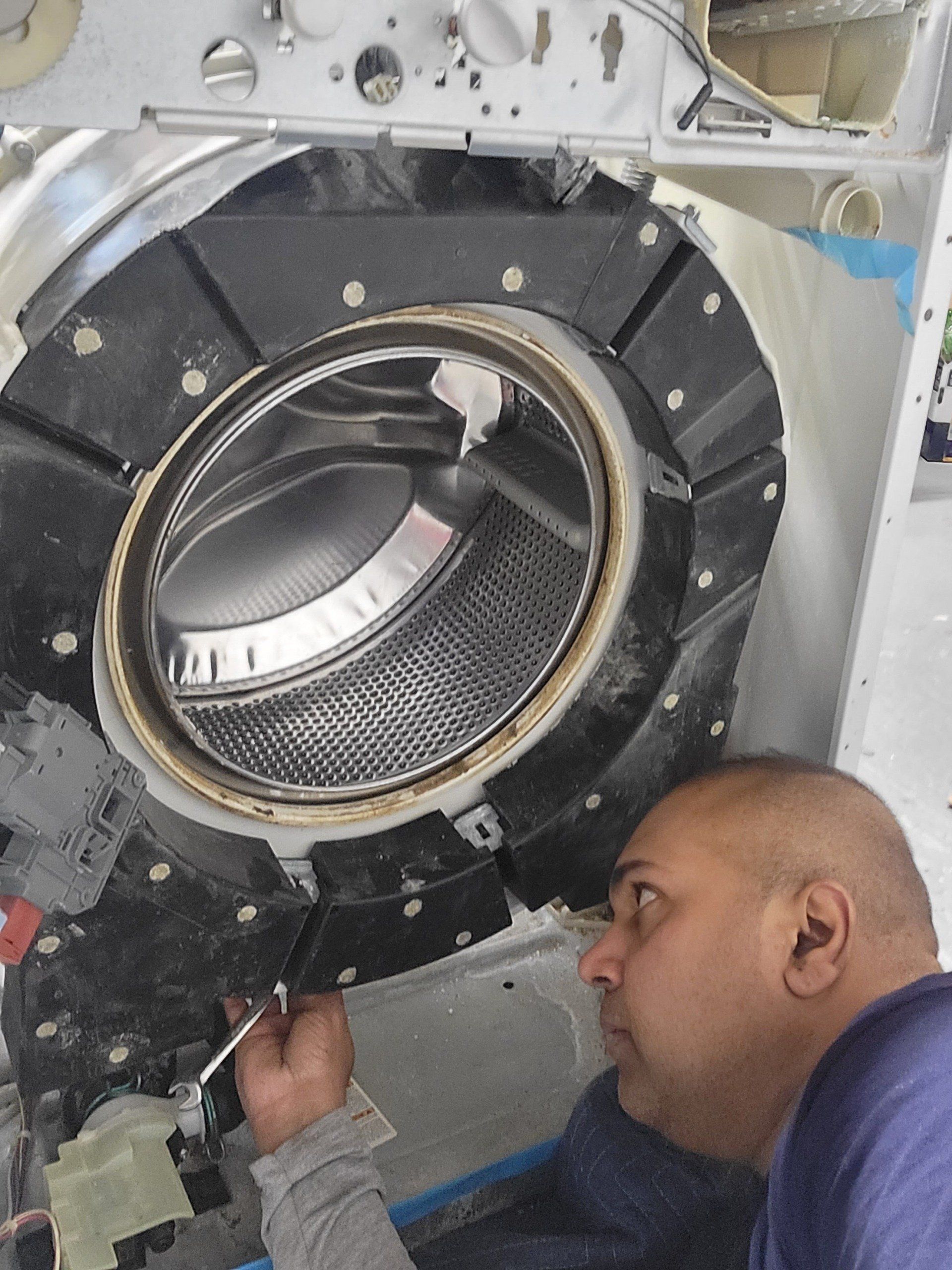 handyman repairing a washing machine