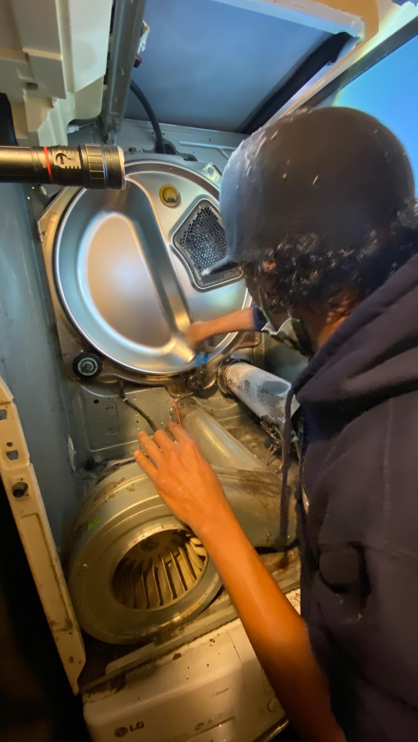 Plumber with clipboard near washing machine