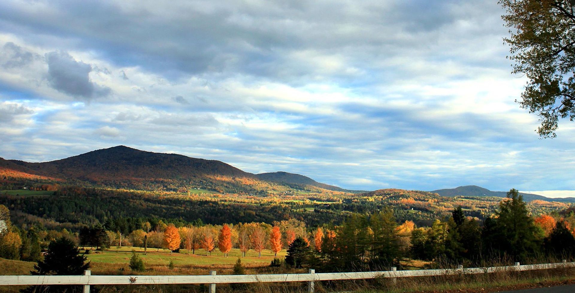 Burke, Vermont mountains in fall under a cloudy sky