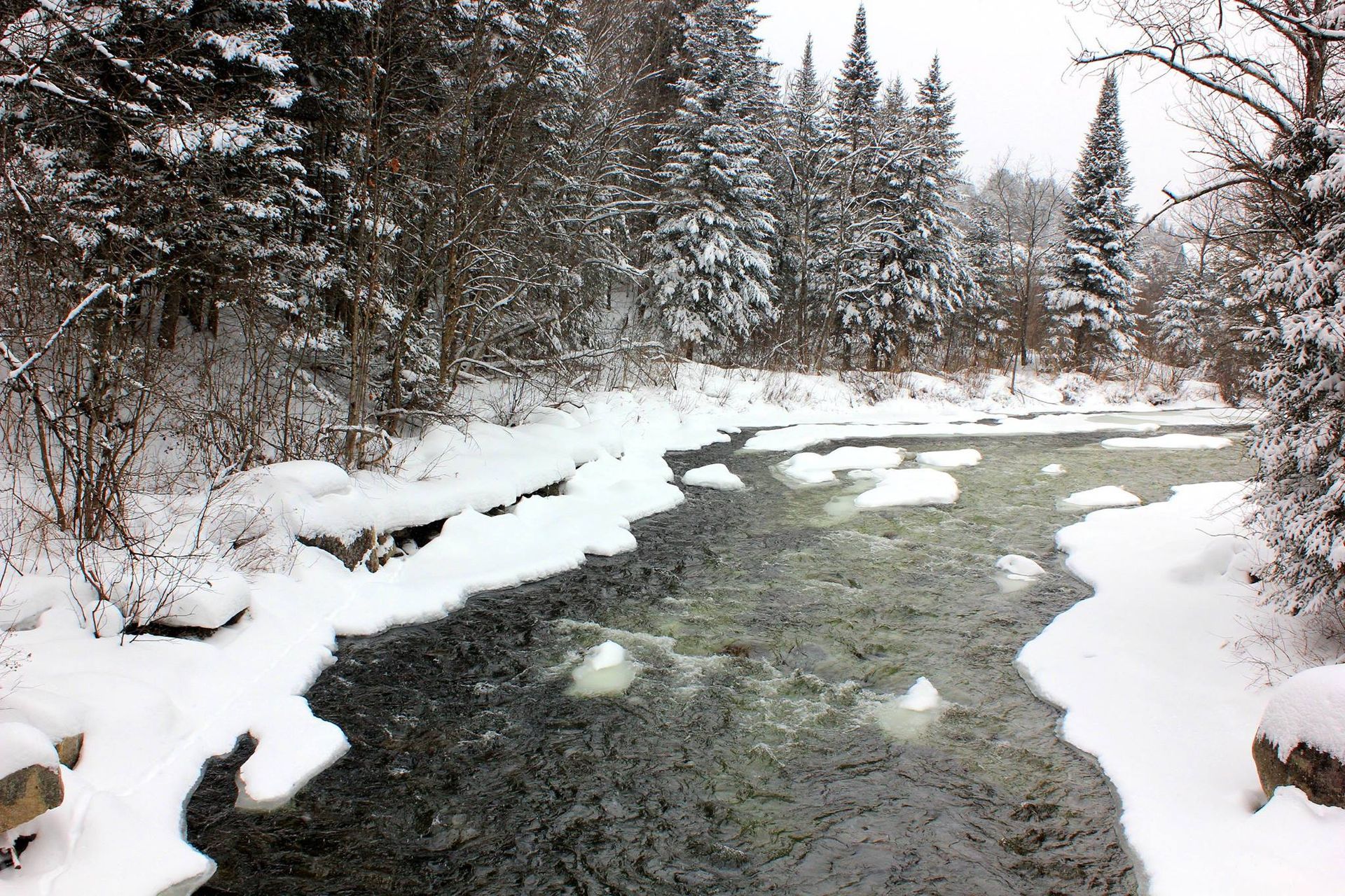 A river surrounded by snow in Burke, Vermont