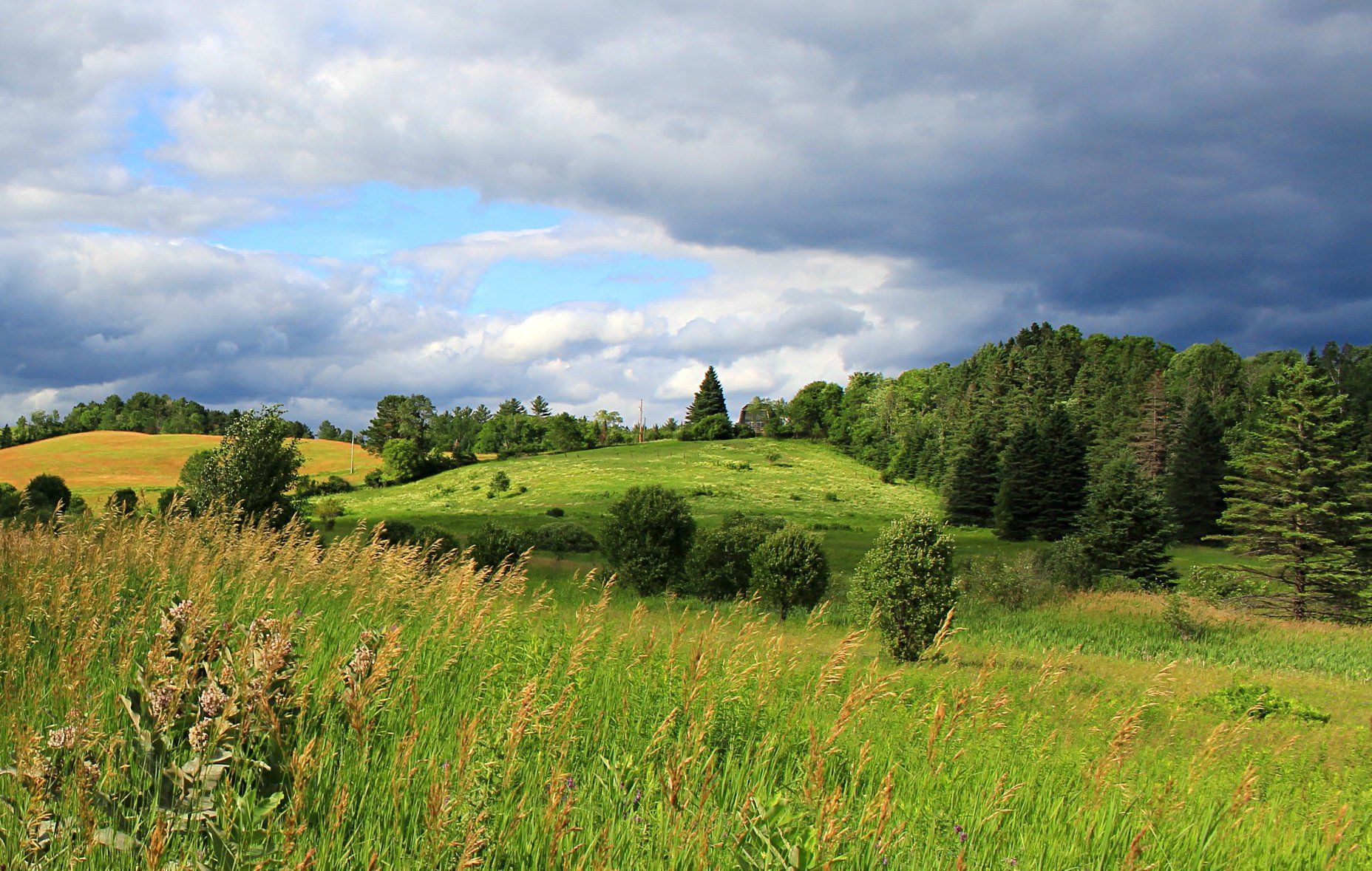 A view of the hills in Burke, Vermont with cloudy skies