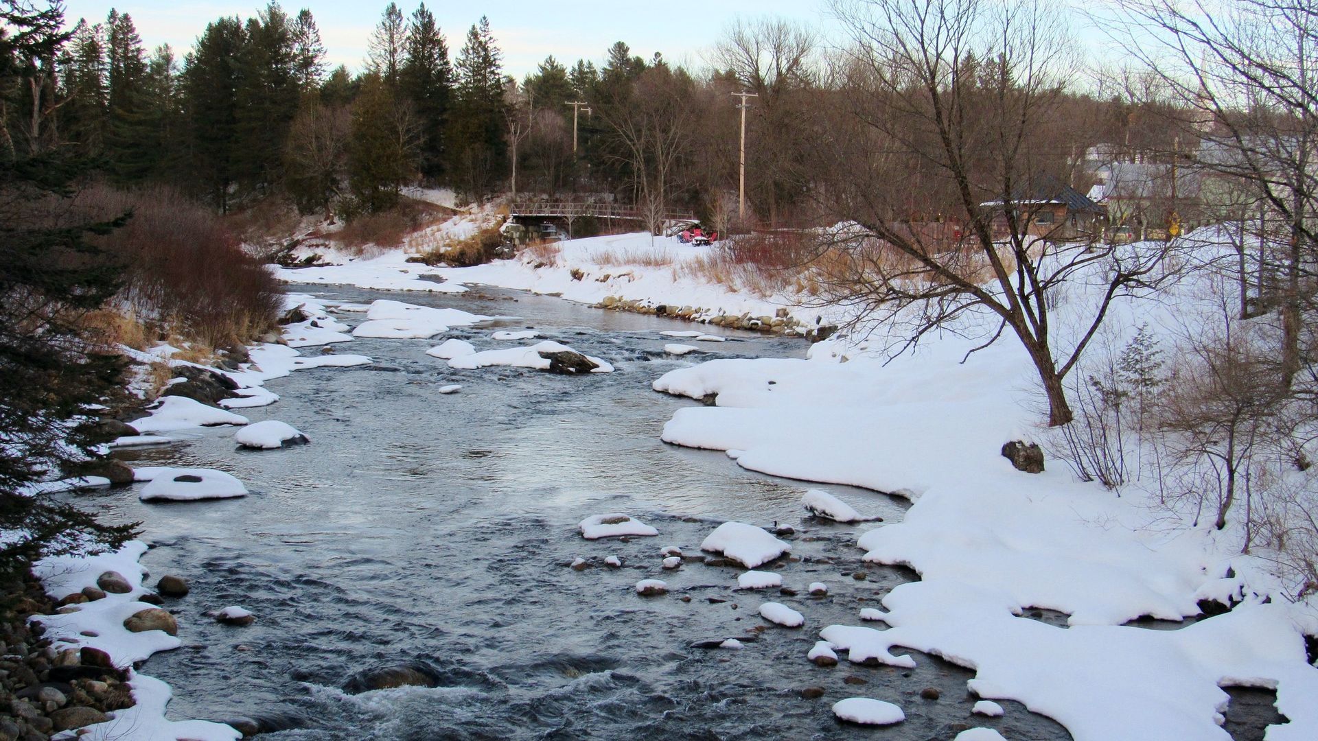 A river surrounded by snow in Burke, Vermont