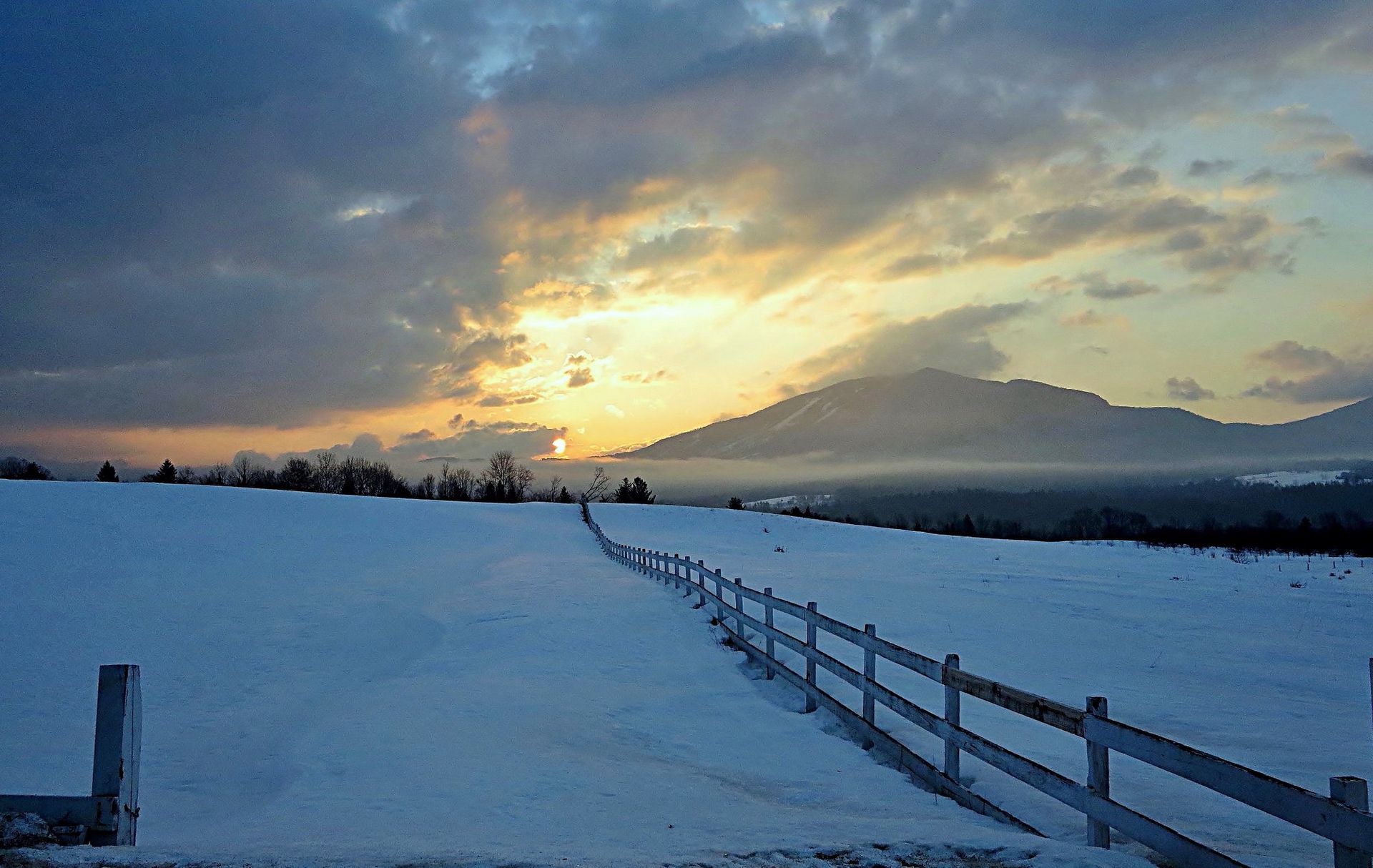 a gorgeous view of Burke mountains in Burke, Vermont  during sunset in Winter