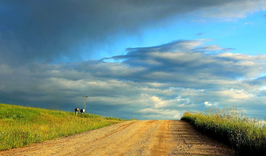 A road sits beneath a stormy sky in Burke, Vermont