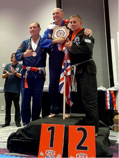 A man in a suit and tie is smiling for the camera.