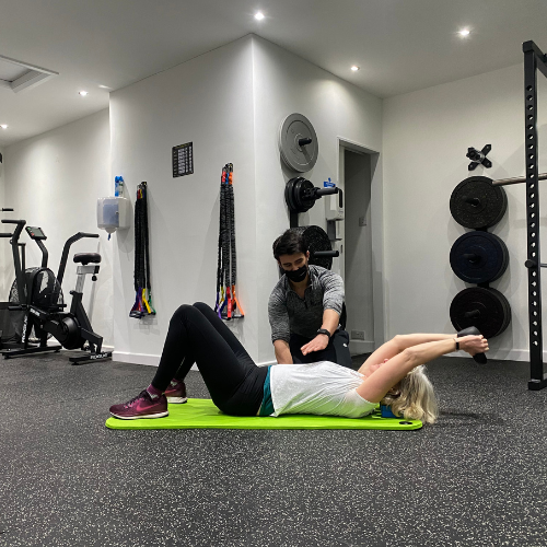 A man in a suit and tie is smiling for the camera.