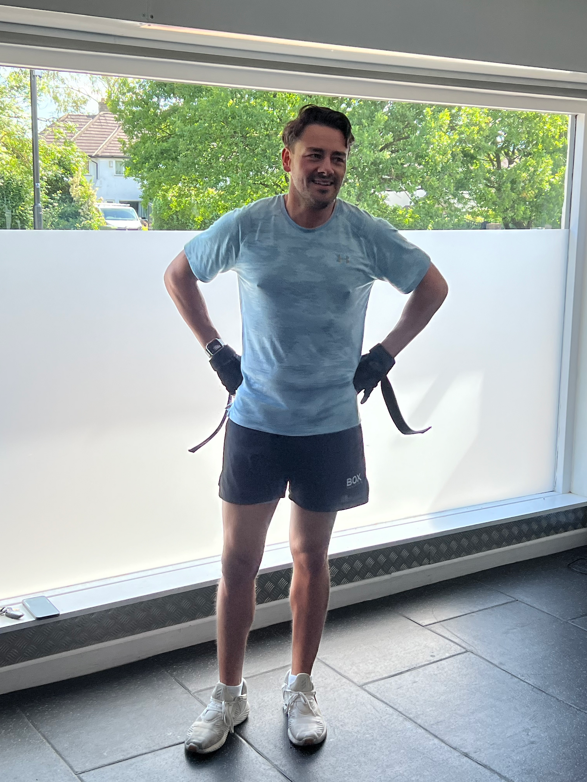 A man in a suit and tie is smiling for the camera.