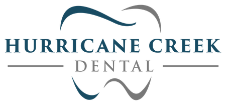 A logo for a dental office called hurricane creek dental.