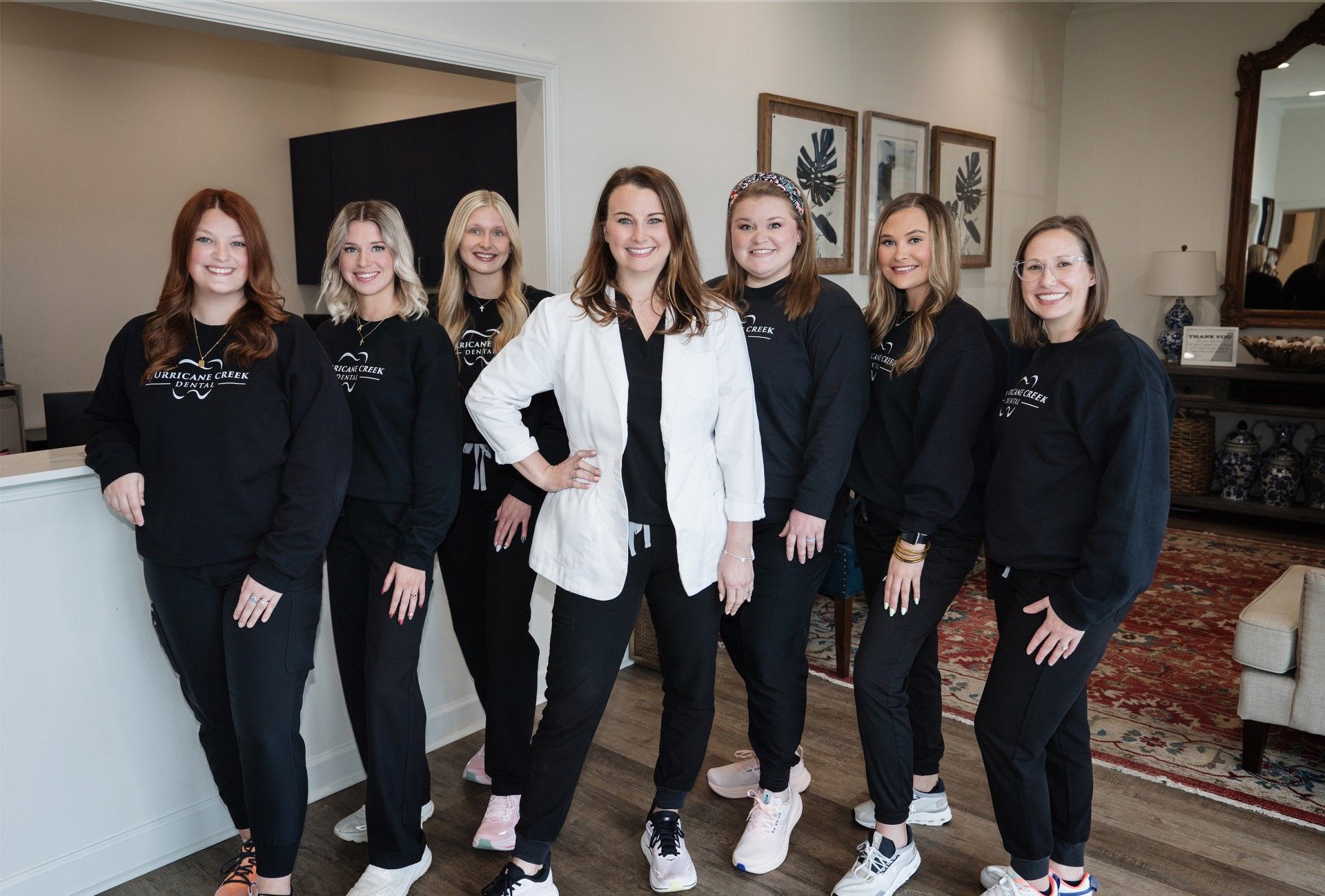 A group of women are posing for a picture together.