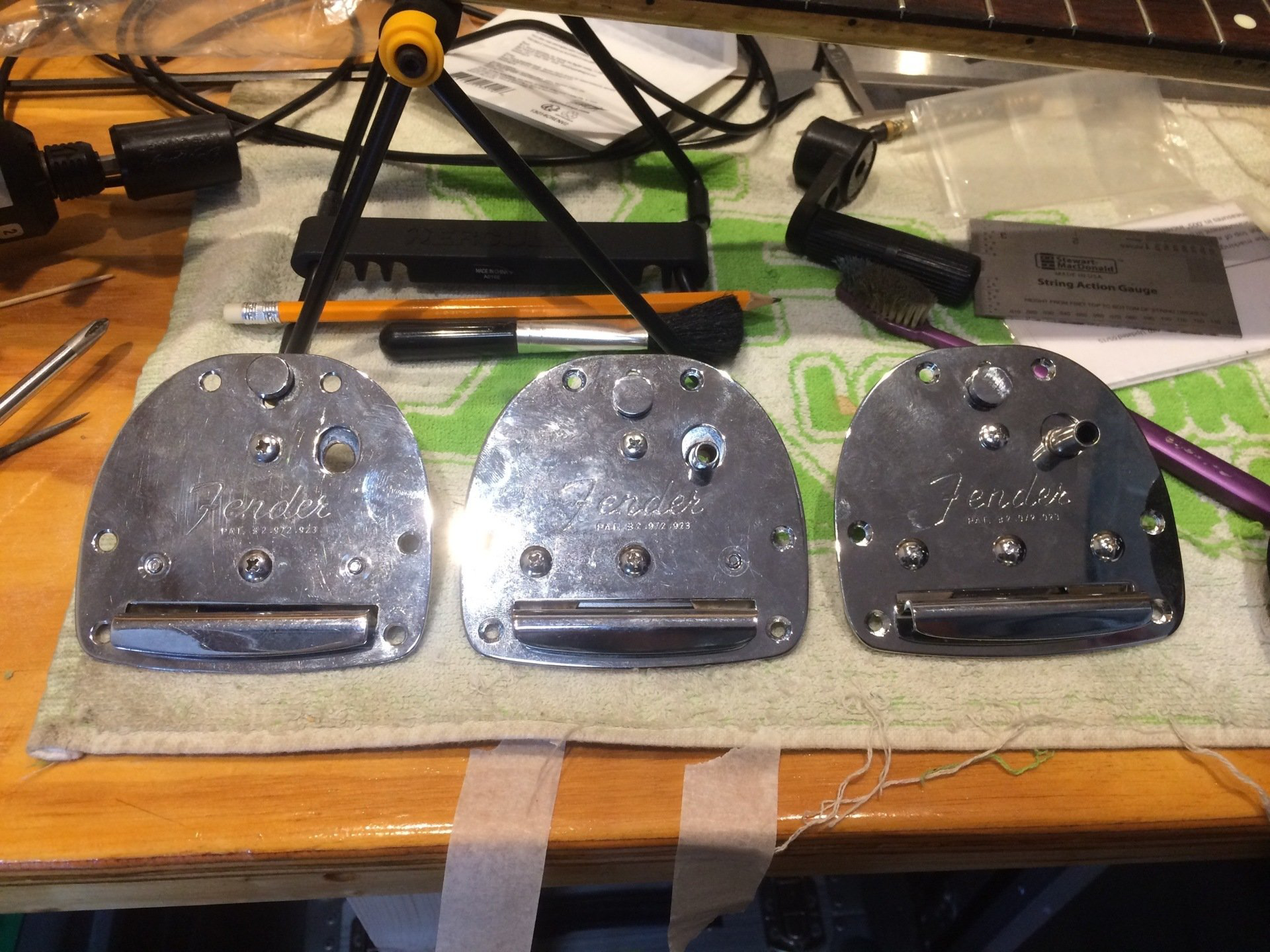 Replaced tremolo blocks for a Fender Jazzmaster on the work bench at New Cut