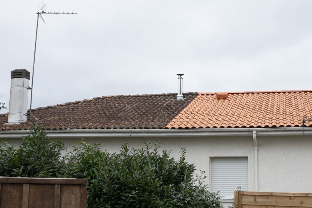 A White House With a Red Tiled Roof and a Chimney — AD House Wash & Gutter Cover in East Toowoomba, QLD