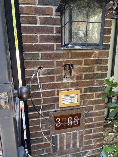 A brick wall with a number 3-68 on it