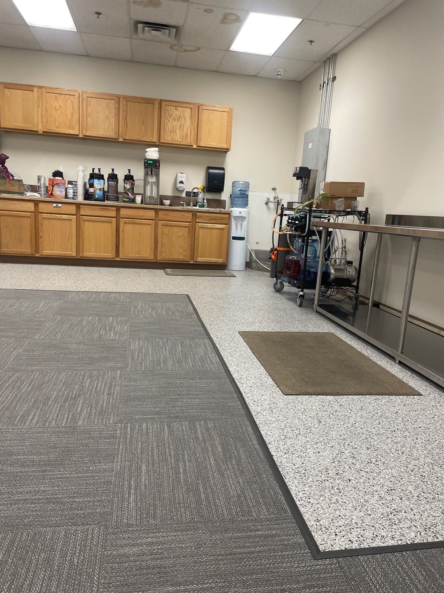 A kitchen with wooden cabinets and stainless steel appliances.