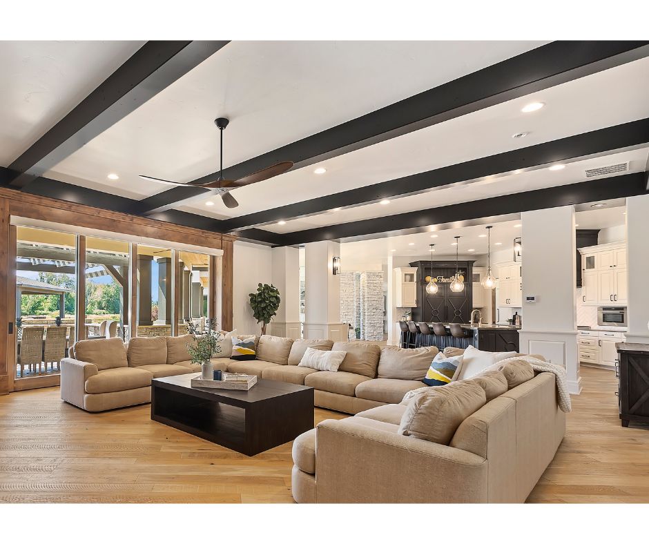 A living room filled with furniture and a ceiling fan.