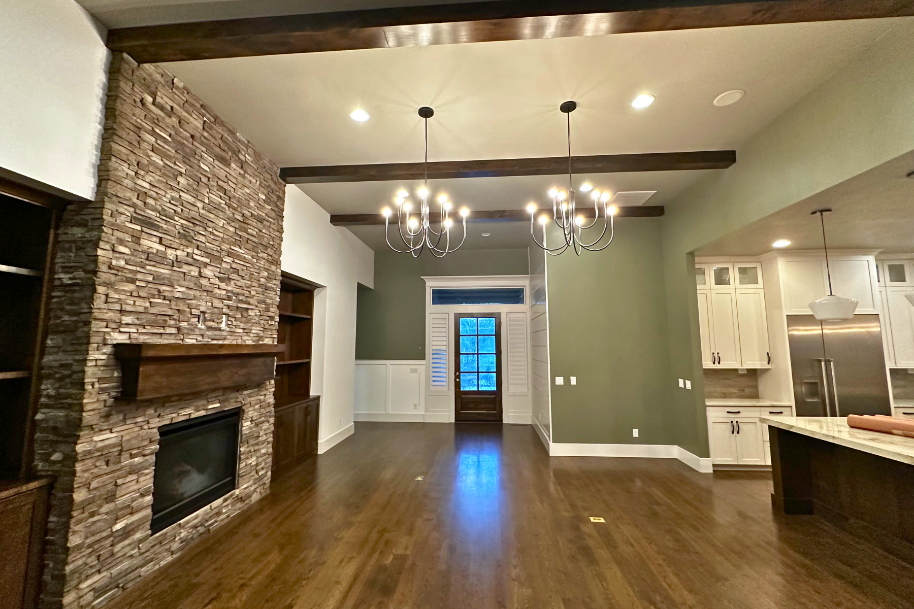 There is a fireplace in the middle of the living room.