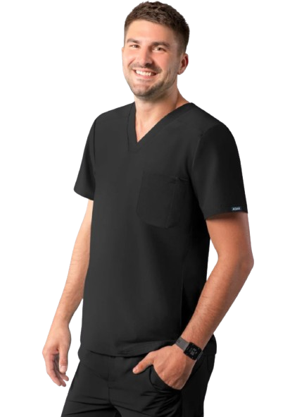 Man in black scrubs, smiling, with one hand in pocket. White background.