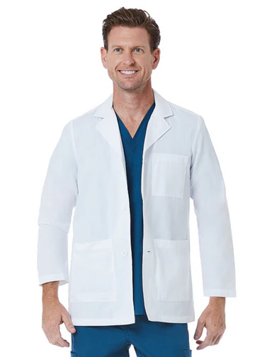 Man wearing a white lab coat over teal scrubs, smiling.