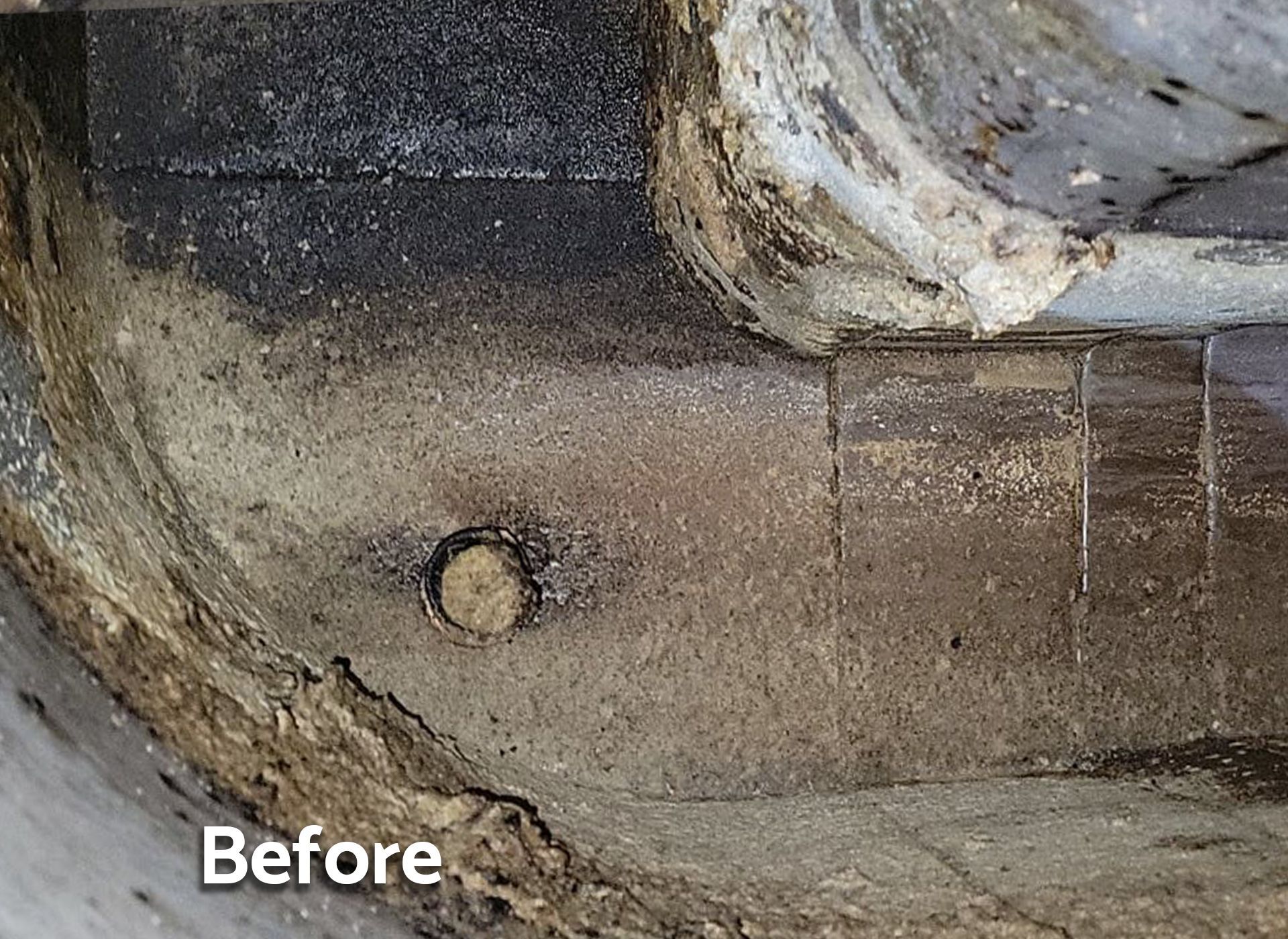 A before picture of a hole in a concrete wall