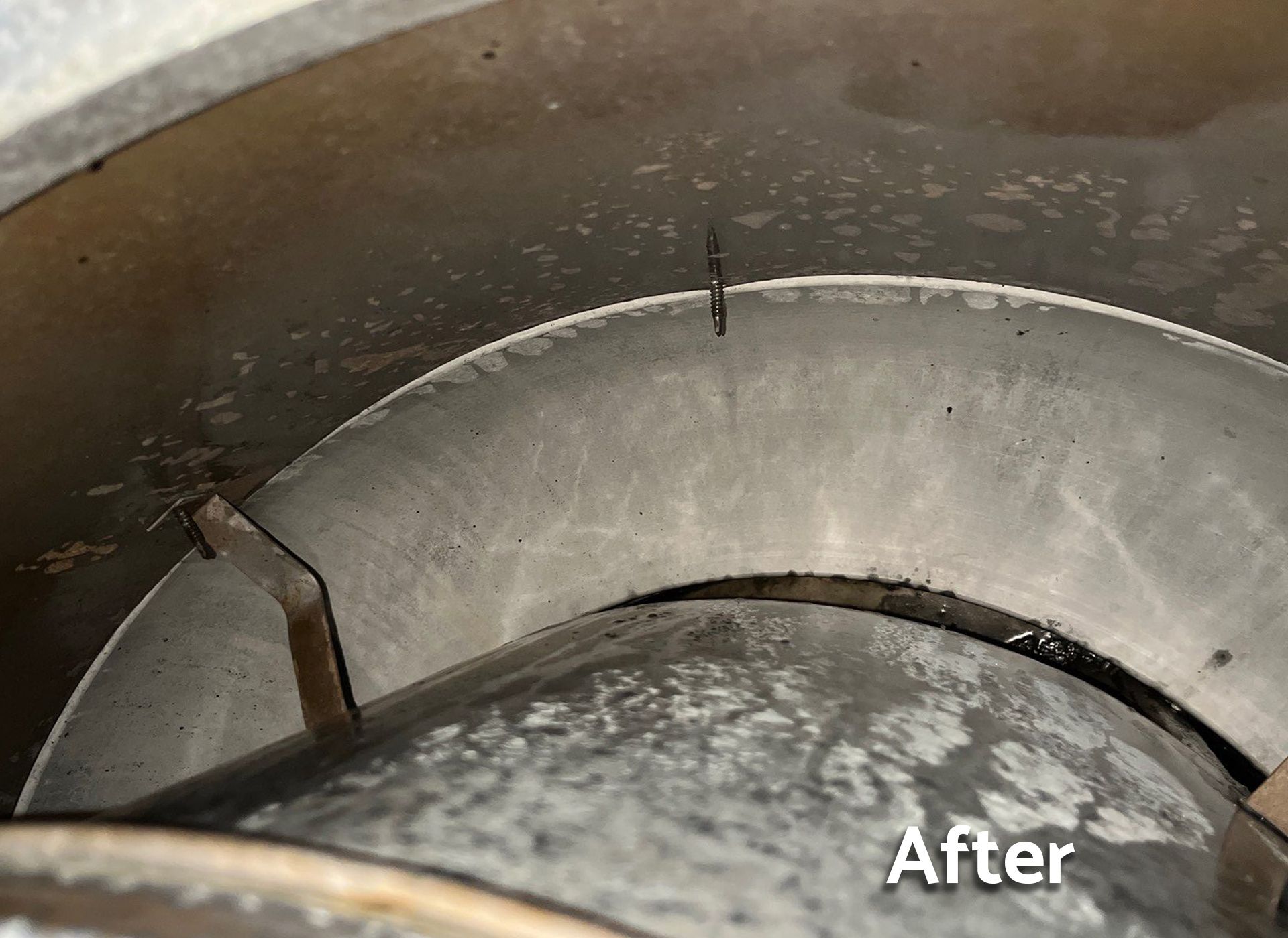 A close up of a metal pipe with the words `` after '' written on it.