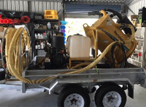 Gutter cleaning equipment on back of trailer