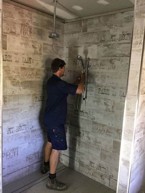 Plumber installing shower in Gladstone - Plumbing Gladstone