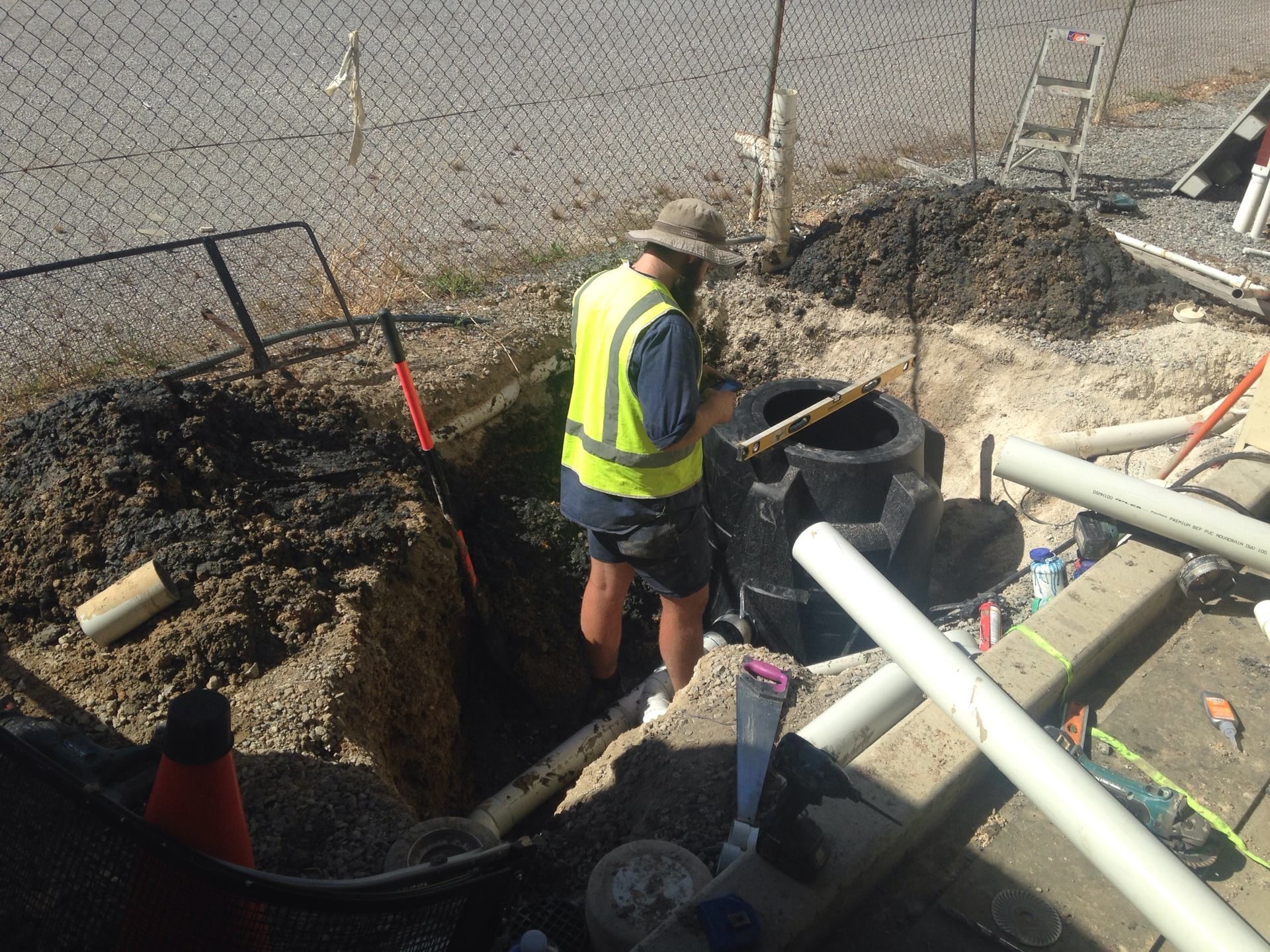 A Plumber Working On A Pipe