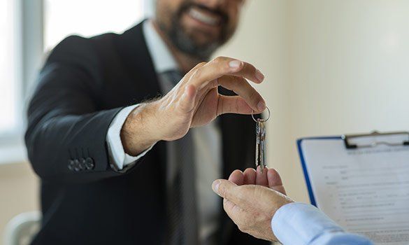 Man Handing Keys — Summerville, SC — Corvino Insurance Agency, Inc.