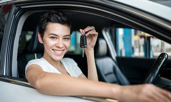 Woman Holding Car Key — Summerville, SC — Corvino Insurance Agency, Inc.
