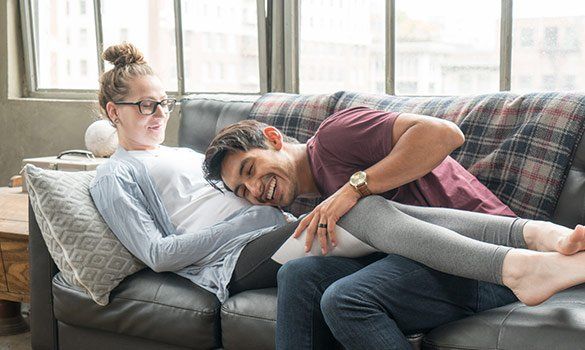 Couple Laying On Couch — Summerville, SC — Corvino Insurance Agency, Inc.