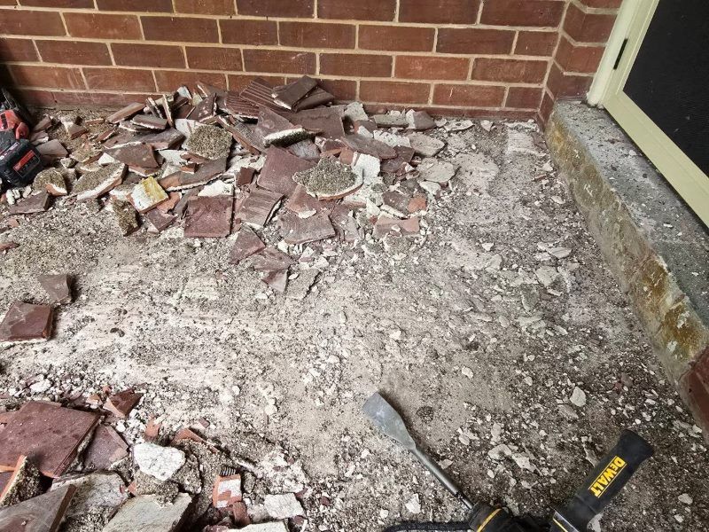Debris From Removed Tiles On A Brick Wall, Front Step Area — David Son Tiling in Springdale Heights, NSW