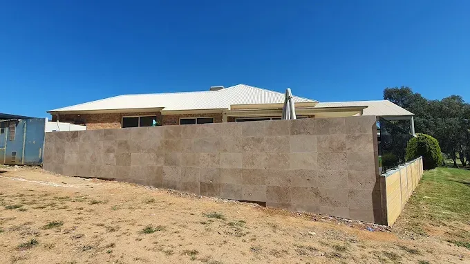Patio With Bench, Plants, And Black Gate — David Son Tiling in Springdale Heights, NSW