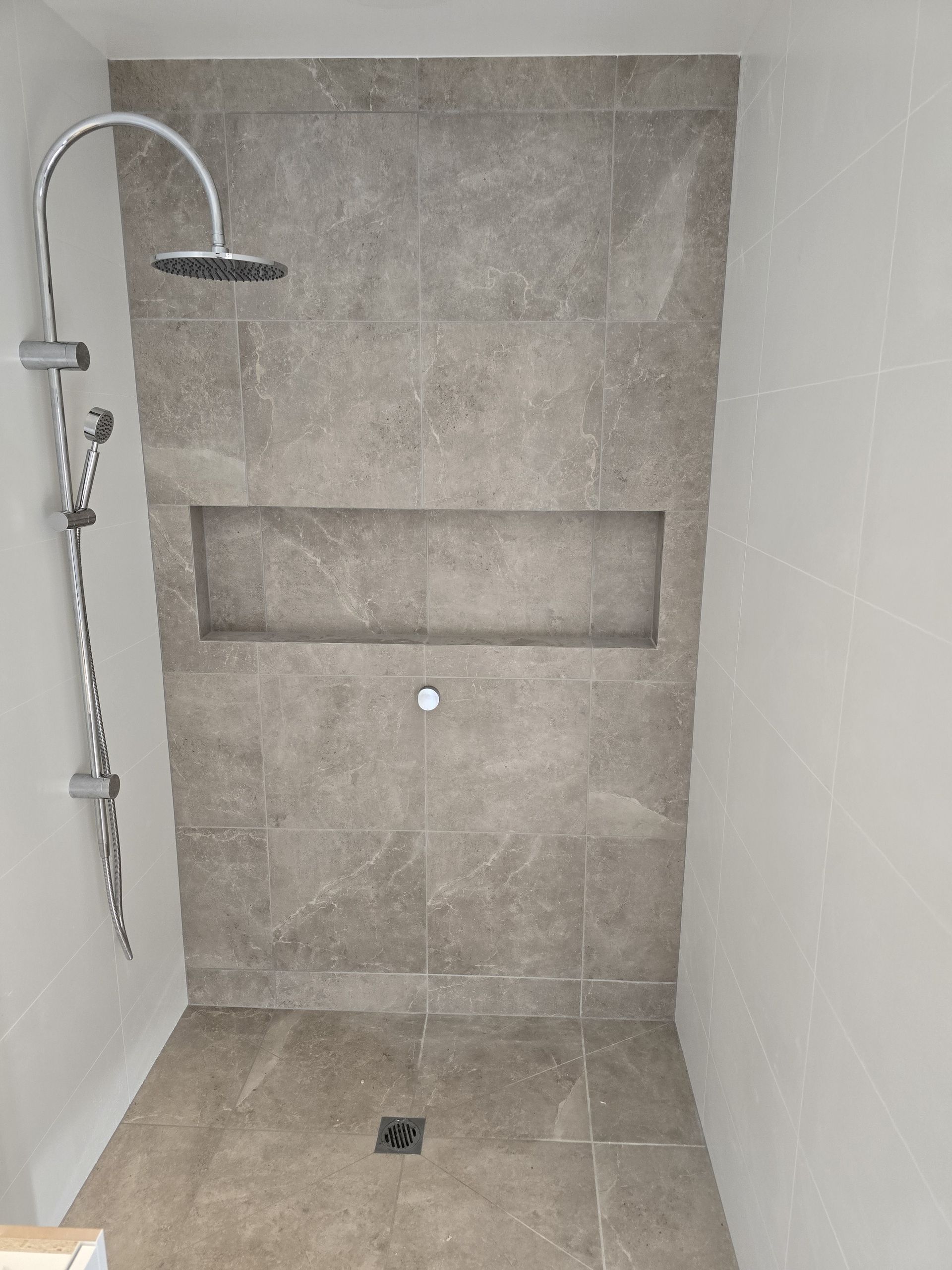 Bathroom With White Tiles, Sink, And Cabinet — David Son Tiling in Springdale Heights, NSW
