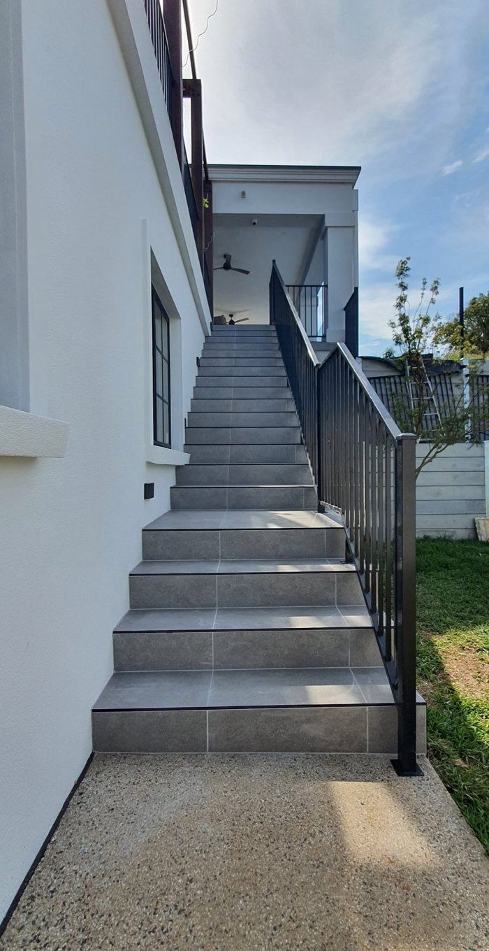 Exterior Stairs Leading Up To A White Building — David Son Tiling in Springdale Heights, NSW